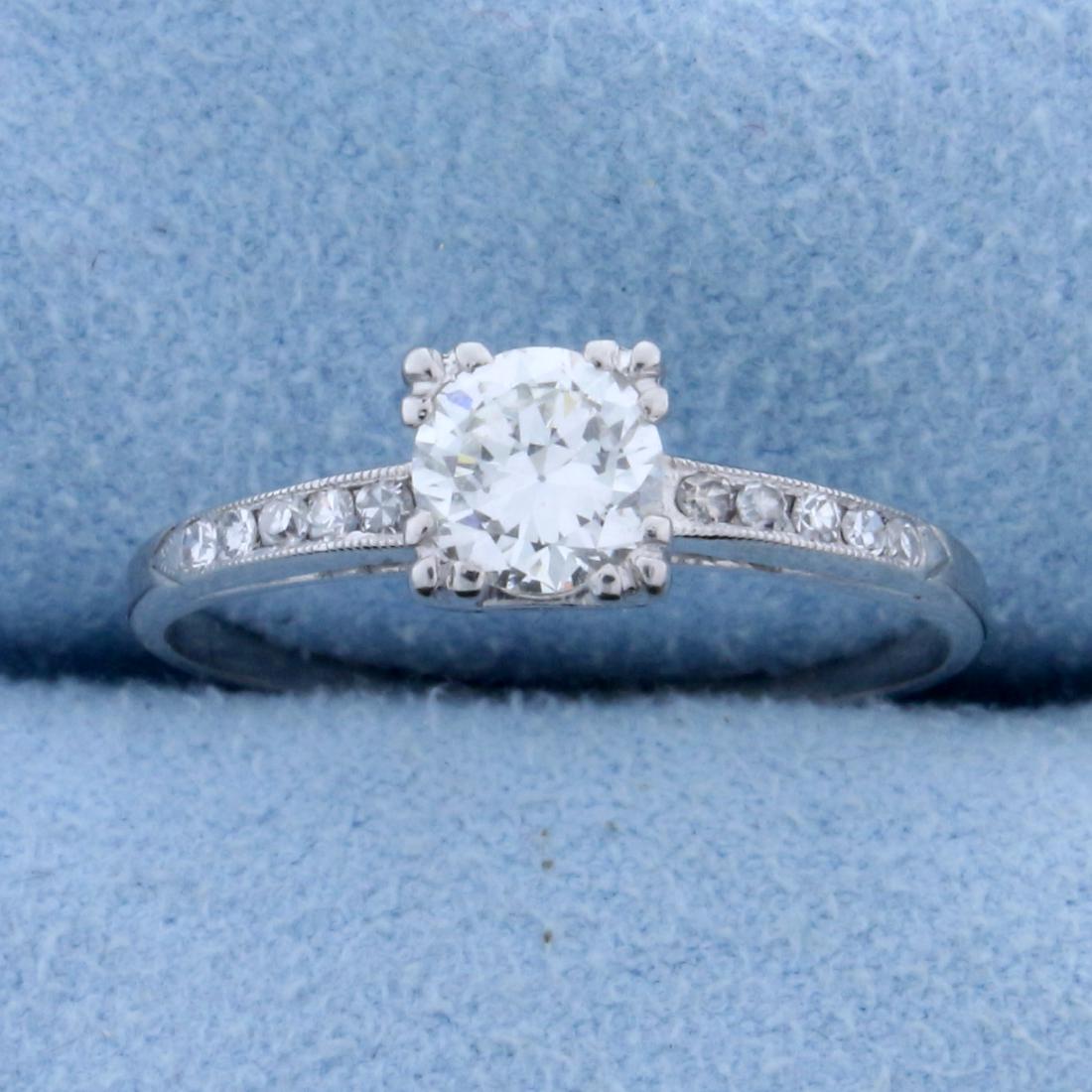 .6 ct TW Diamond Engagement Ring in Platinum: In platinum. Center diamond is a .55 ct high quality round brilliant diamond with a clarity, VS clarity/H color. Great cut for lots of sparkle. There are ten 1/2 pt diamonds in shank of similar high q