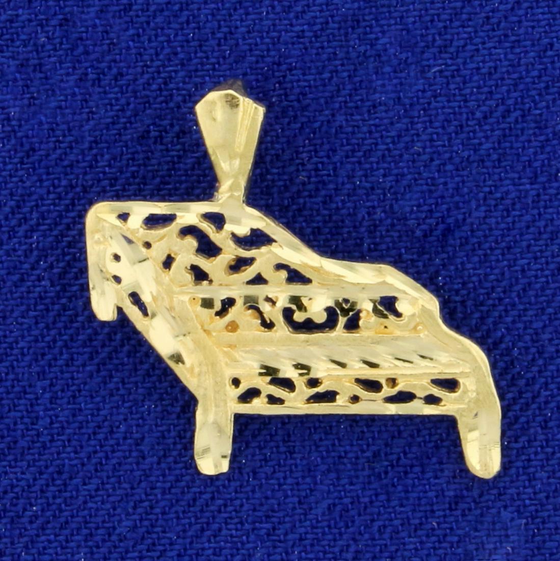 Diamond Cut Piano Pendant in 14K Yellow Gold: In 14K Yellow Gold. Diamond Cut for extra sparkle. 3/4 inch long. 1.0g