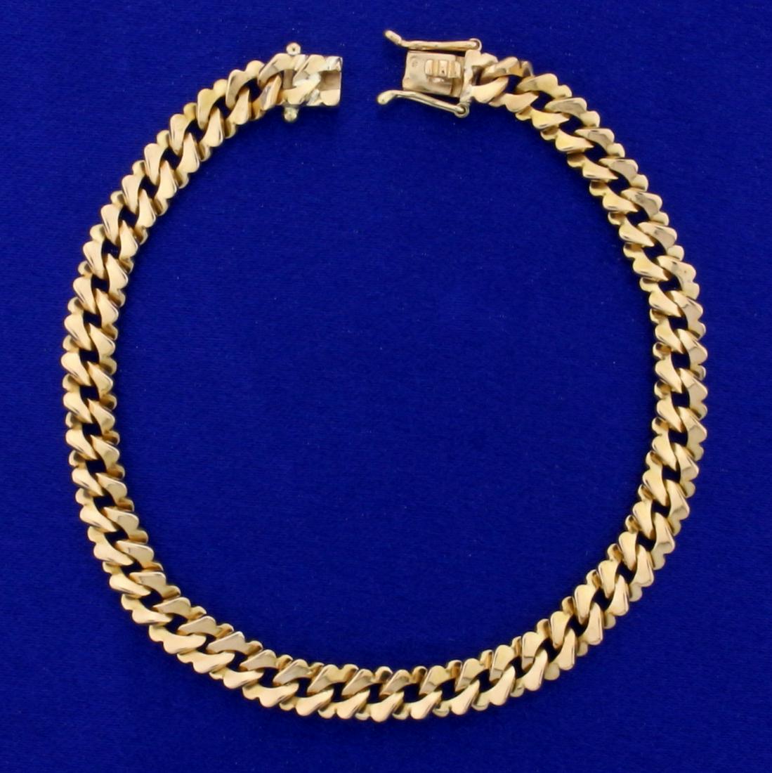 Heavy Fancy Cuban Link Bracelet in 18K Yellow Gold: In 18K Yellow Gold. 8 inches long and 6.4mm wide. Double safety clasp. 21.9g