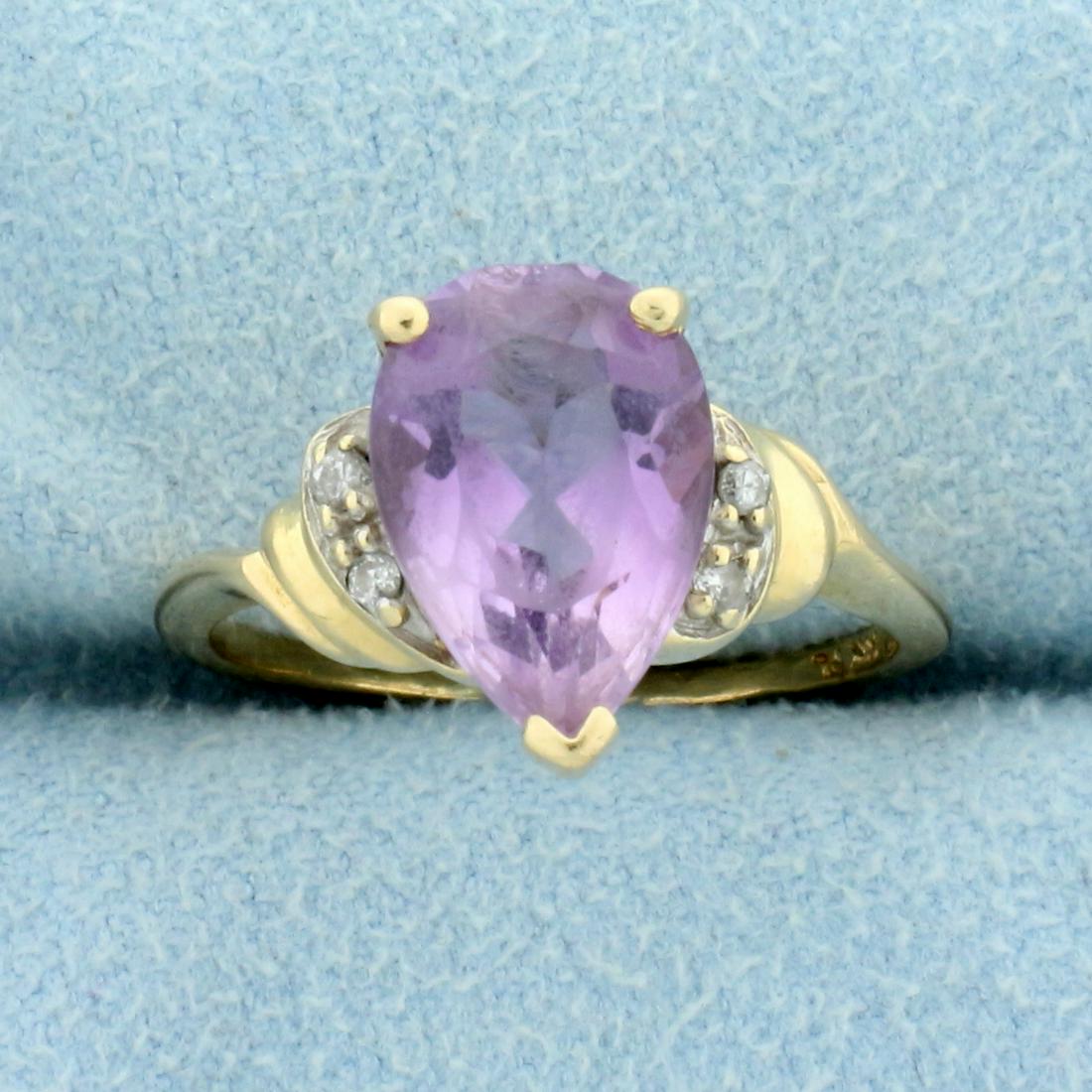3ct Amethyst and Diamond Ring in 14K Yellow Gold: In 14K Yellow Gold. Contains one high quality natural 11x8mm pear cut Amethyst gemstone with beautiful pastel purple color and excellent clarity. Also contains four high quality 1/2pt Diamonds. Size 6