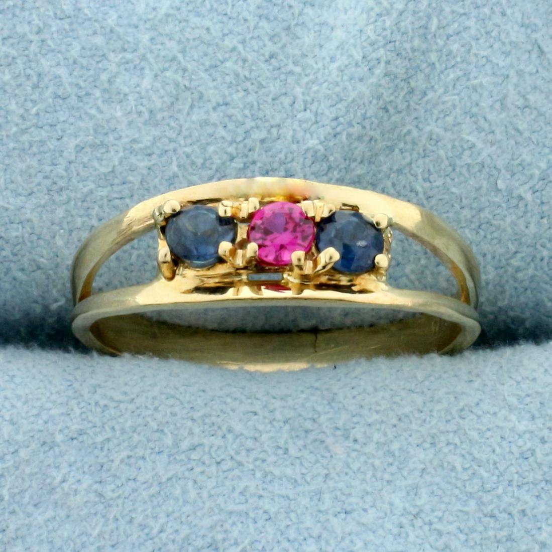Three-Stone Pink and Blue Sapphire Ring in 14K Yellow: In 14K Yellow Gold. Contains three high quality natural 3mm sapphire gemstones, two blue and one pink, all with intense color and excellent clarity. Size 6 1/2. 2.0g