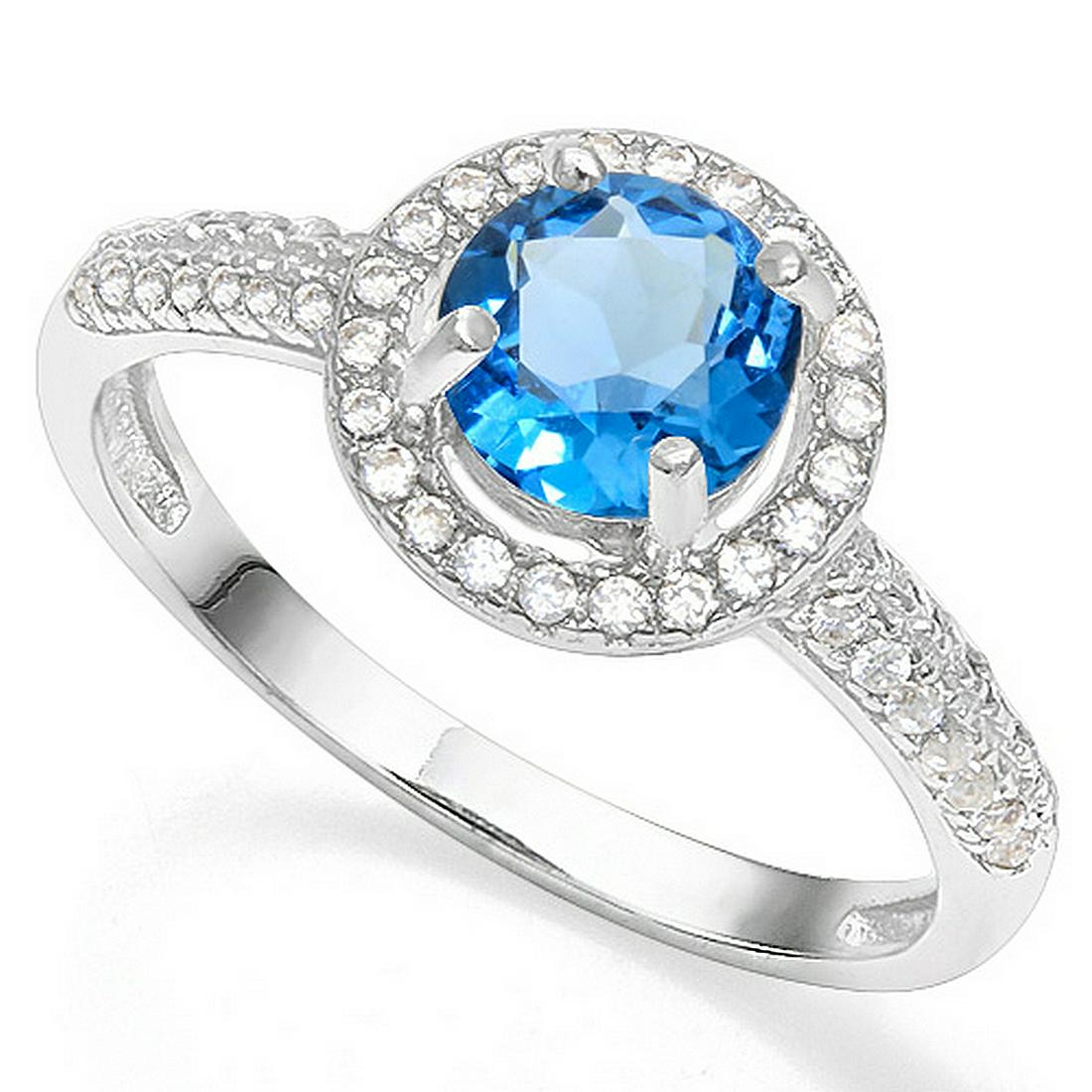 London Blue Topaz and Diamond Halo Style Ring in: Contains 1-5mm round cut lab created London Blue Topaz with halo style gems and .01ctw diamond accent. Set in platinum over .925 sterling silver, size 7. 1.9g