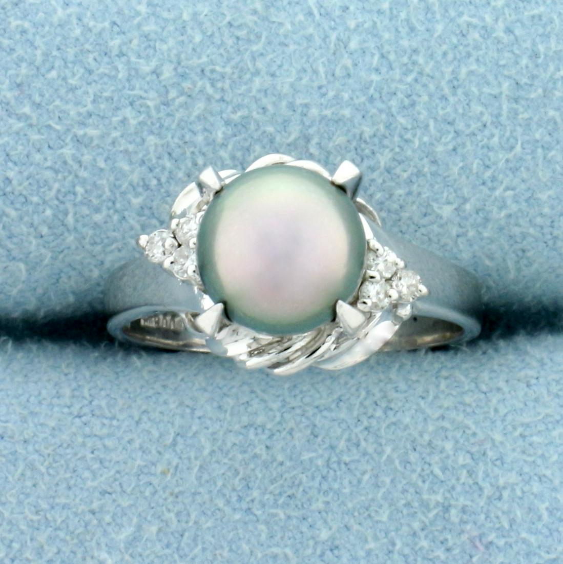 7.7mm Tahitian Pearl and Diamond Ring in Platinum: In Platinum . Contains a high quality AAA 7.7mm Tahitian Pearl with silver color and pink overtones and with excellent luster. Also contains six high quality Diamonds, .08ct TW, SI clarity/H color. Si