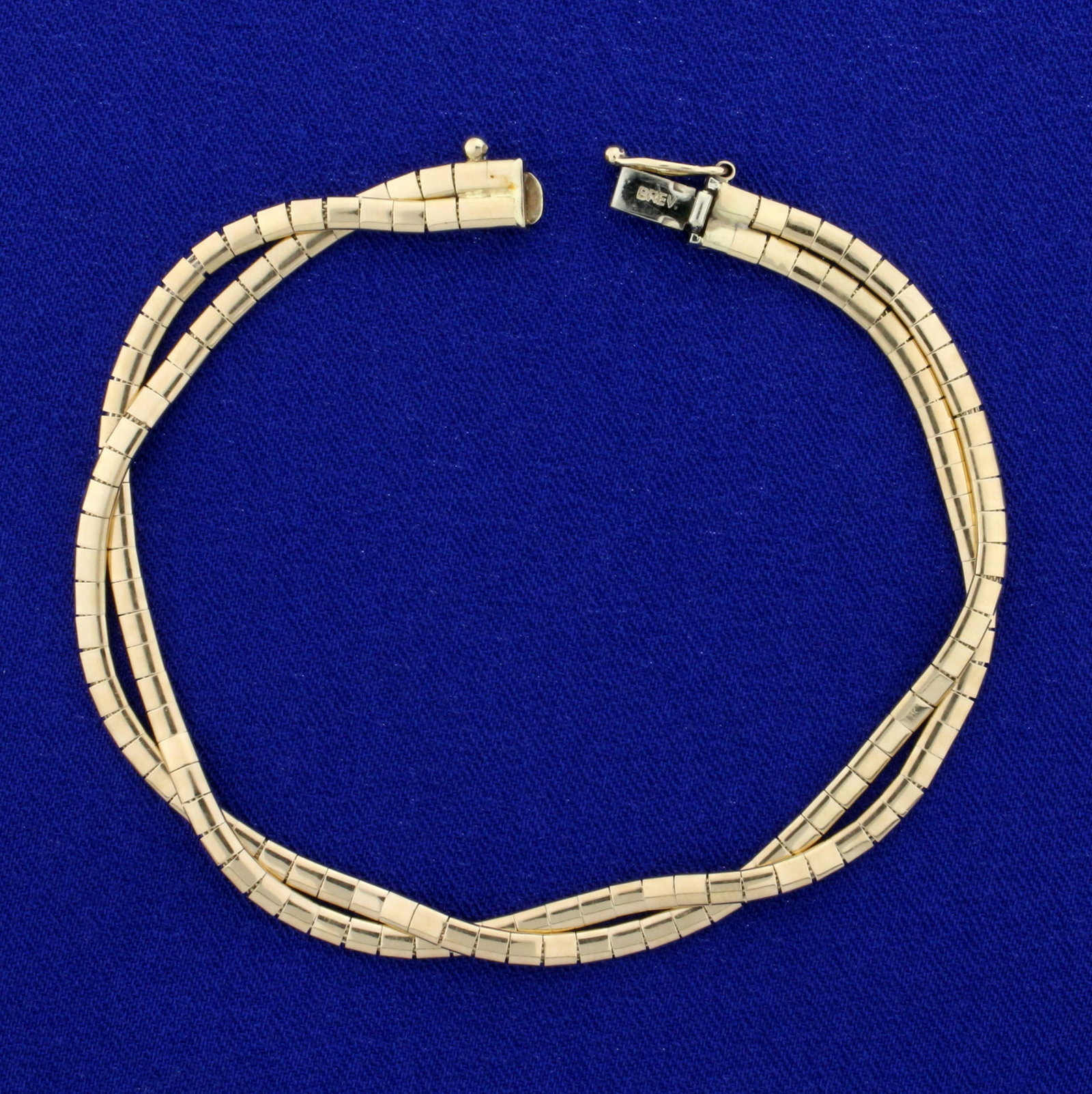 Italian-Made 7 1/2 Inch Braided Double Strand Omega: In 14K Yellow Gold. 7 1/2 inches long, 4.5mm wide. Safety Clasp. 11.1g.