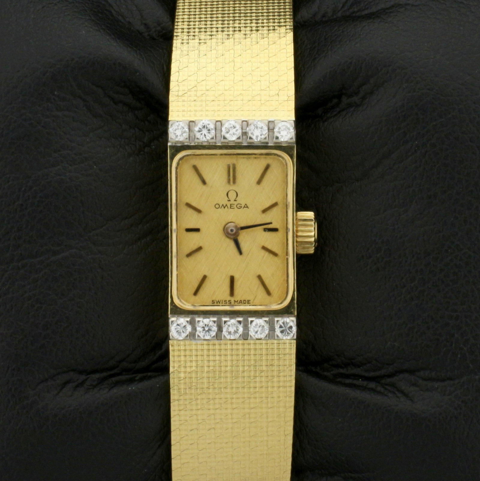 Vintage 18k Solid Gold Diamond Omega Windup Wristwatch: Solid 18K Yellow Gold Case and Band. Contains ten high quality diamonds, 1/4ct TW, VS clarity/H color. Movement runs great. 6 3/4 inches long. 37.2g
