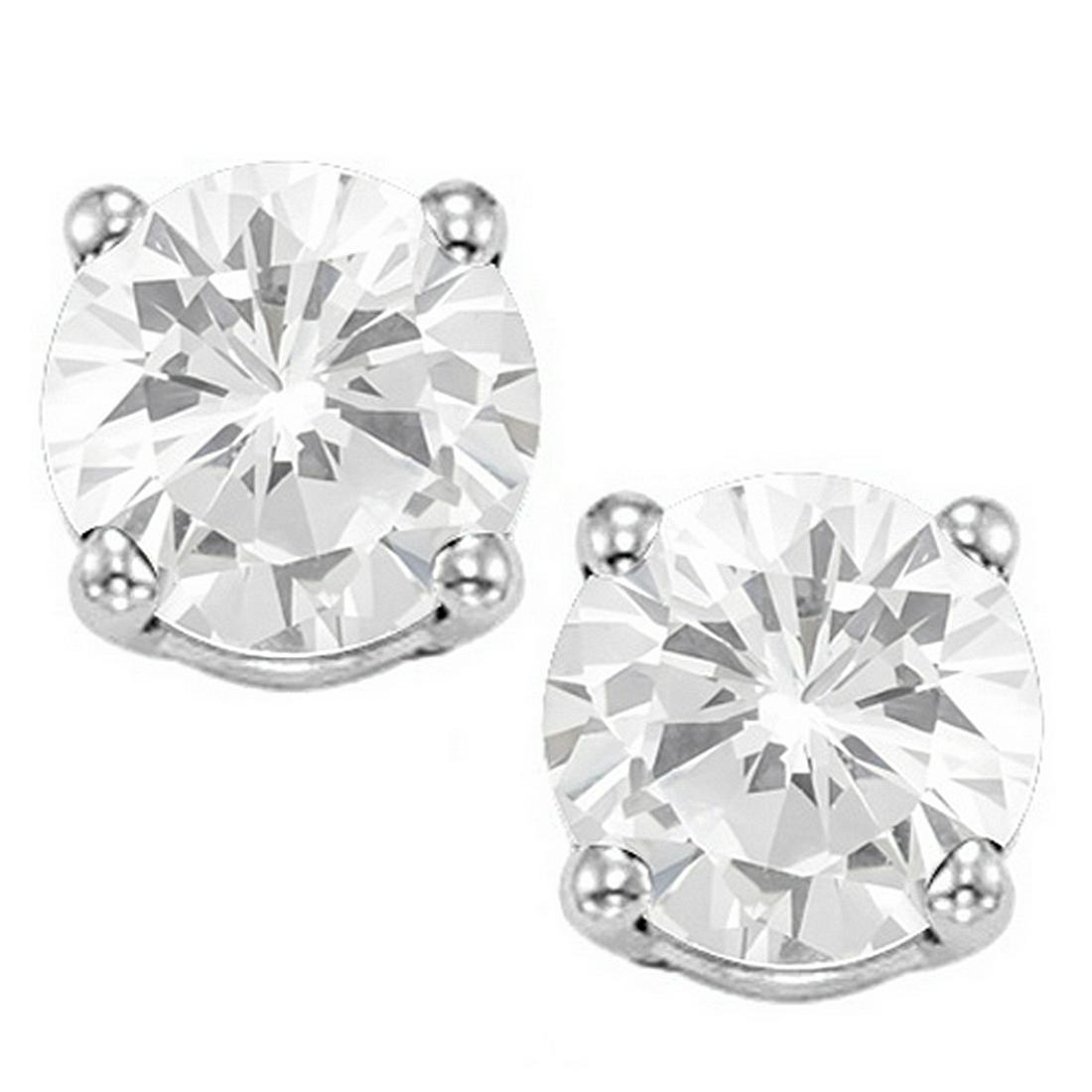 8MM Large White Topaz Stud Earrings in Sterling Silver: Set in platinum over .925 sterling silver, 4-prong basket mountings with friction backs. Contains 2-8mm round cut White Topaz gemstones with excellent clarity and clear ice color. 2.3g