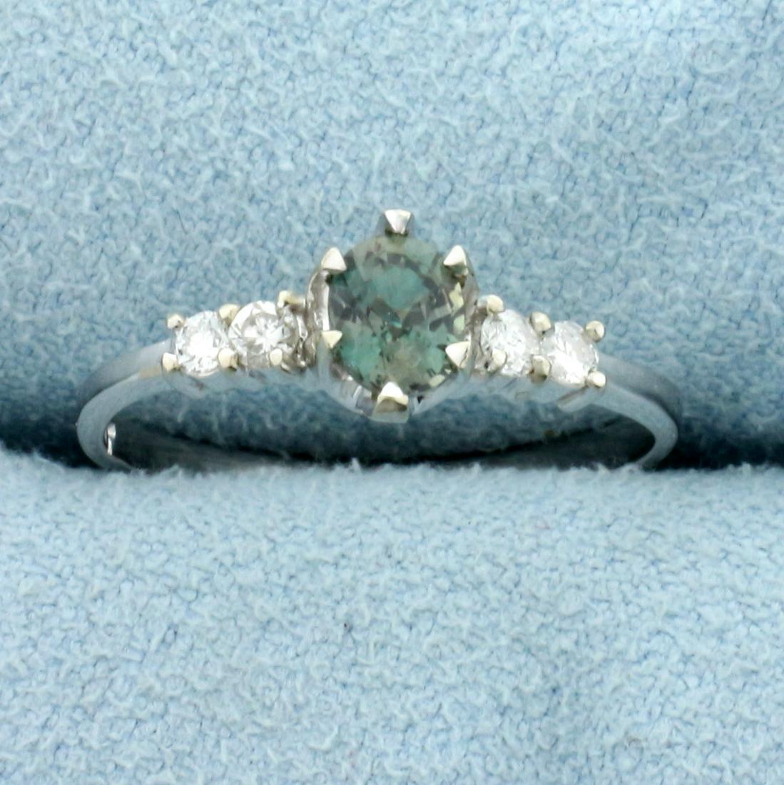 Natural Alexandrite and Diamond Ring in 14K White Gold: In 14K White Gold. Contains one high quality natural 5 x 4mm oval cut Alexandrite gemstone, approximately 1/2ct, with intense color change from green to purple depending on light source. Also contains