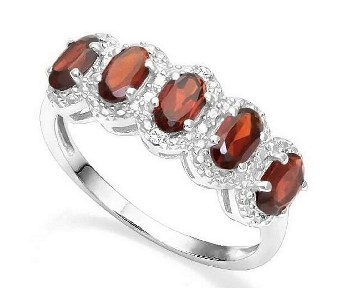 Garnet 5-Stone Halo Ring in Sterling Silver: Ring contains 5-oval cut garnet gemstones, 1.6ctw, accented with .01ctw genuine diamonds. Size 8. Set in platinum over sterling silver, 3.0g.