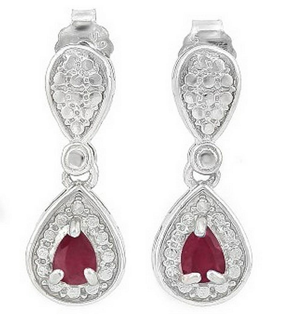 Pear Cut Ruby Dangle Earrings in Sterling Silver: Contains 2-3x4mm pear cut Ruby gemstones with beautiful ruby red color. Metal is fashioned to reflect light in a halo around gemstones. Dangle measures 5/8" long. Set in platinum over .925 sterling si