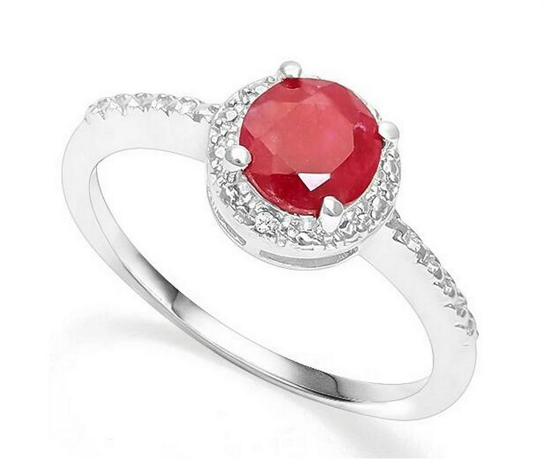 1.1CT Ruby & Diamond Halo Ring in Sterling Silver: Round cut 1.12ct ruby gemstone ring with rustic red color, accented with .01ctw genuine diamonds. Size 8. Set in platinum over sterling silver, 2.2g.