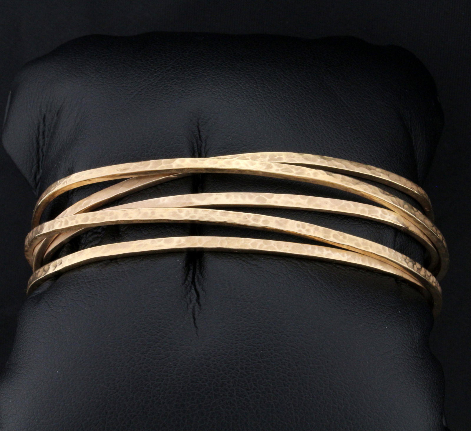 Heavy Designer Hand Made Cuff Bracelet in 14K Yellow: In 14K Yellow Gold. 17mm wide in front, each band is 2mm wide. Inside dimensions 2 1/2 x 1 7/8 inches. Hand pounded design on gold. 27.5g.