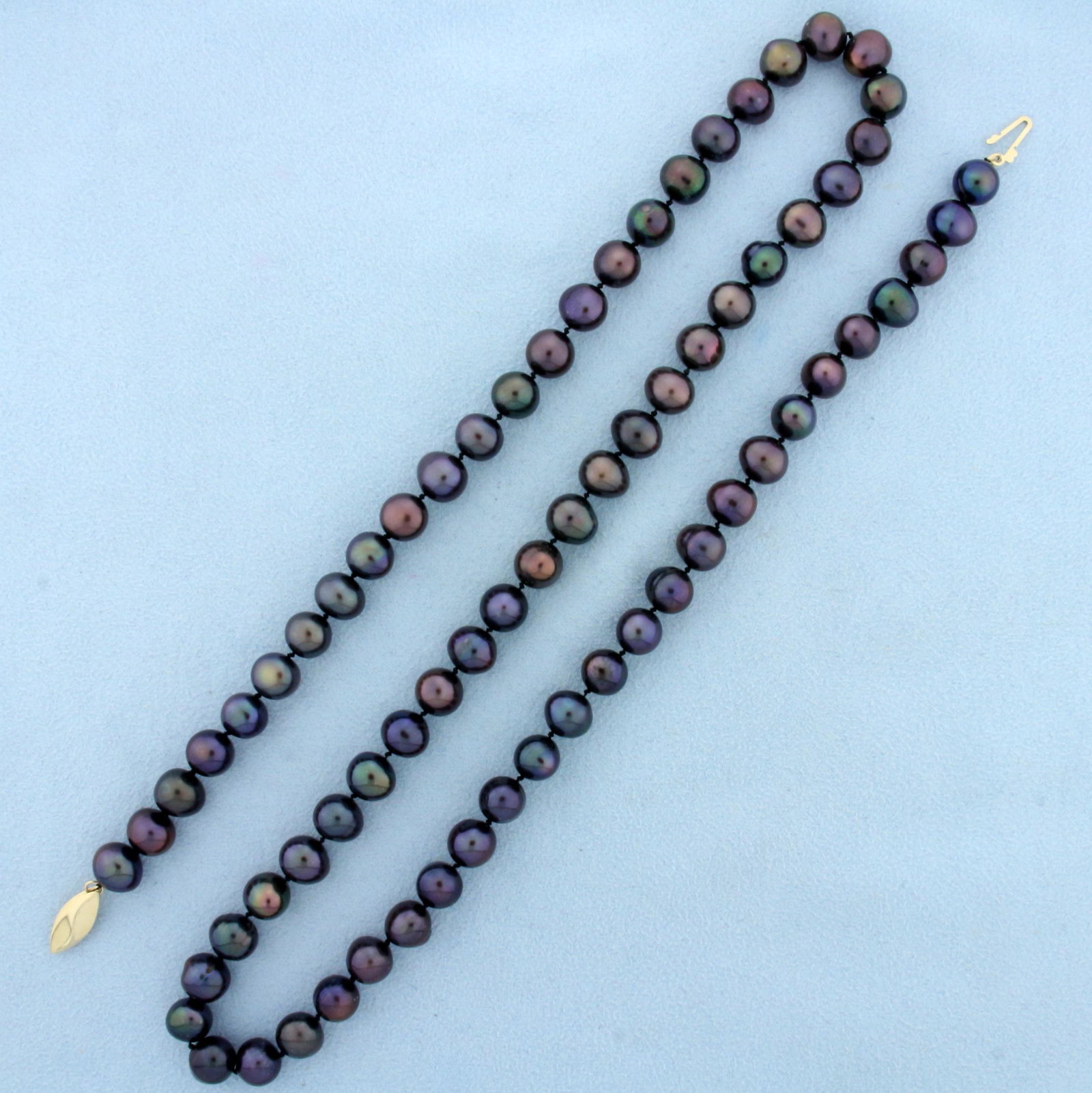 Tahitian Pearl Necklace with 14k Yellow Gold Clasp: In 14K Yellow Gold. Contains seventy high quality natural 7 to 8mm Tahitian Pearls with beautiful iridescent luster. 24 inches long. 48.6g