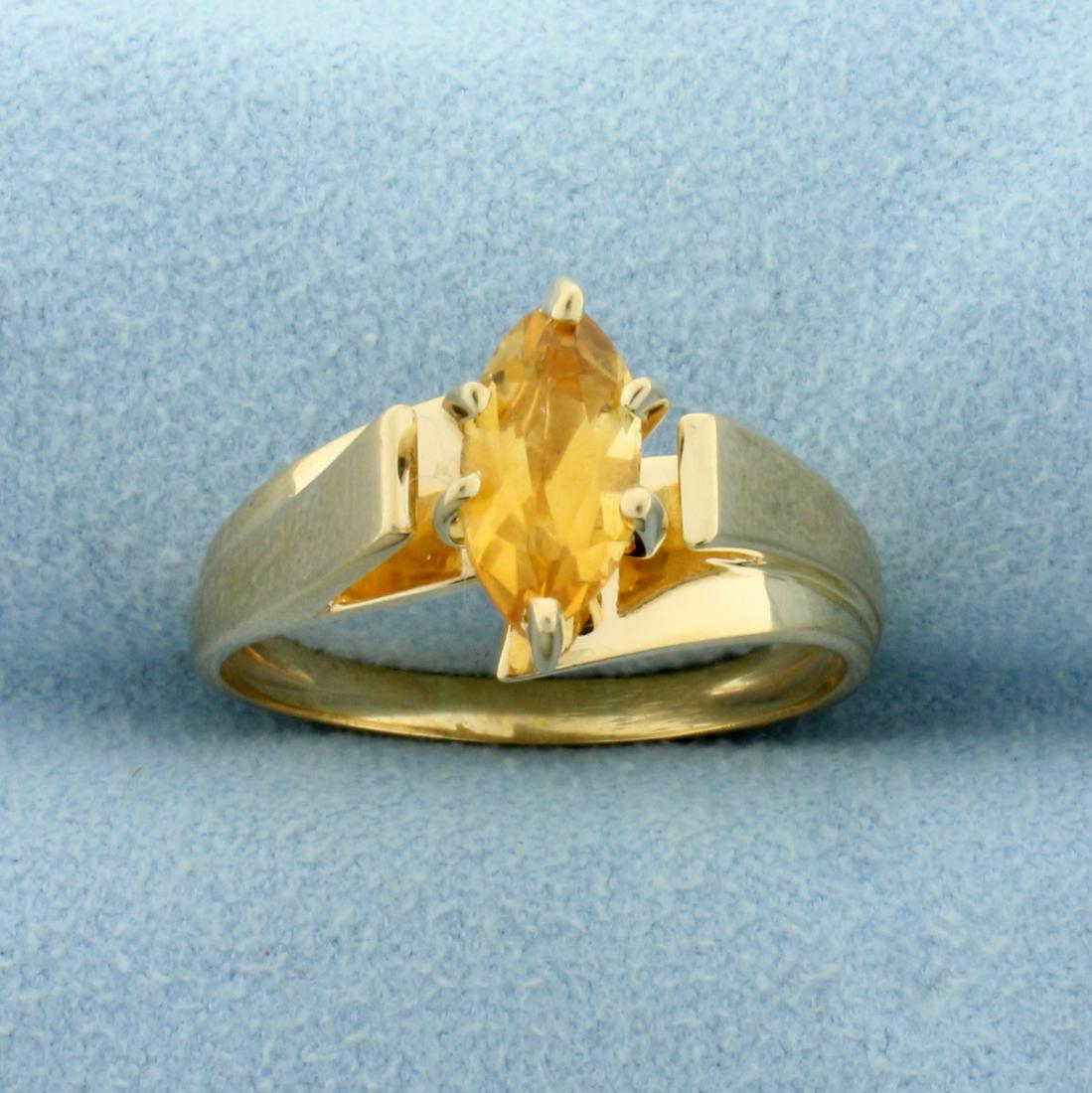 1ct Citrine Solitaire Ring in 14K Yellow Gold: In 14K Yellow Gold. Contains a high quality natural 10 x 5mm marquise cut Citrine gemstone with vibrant yellow color and excellent clarity. Size 8 1/2. 4.0g.