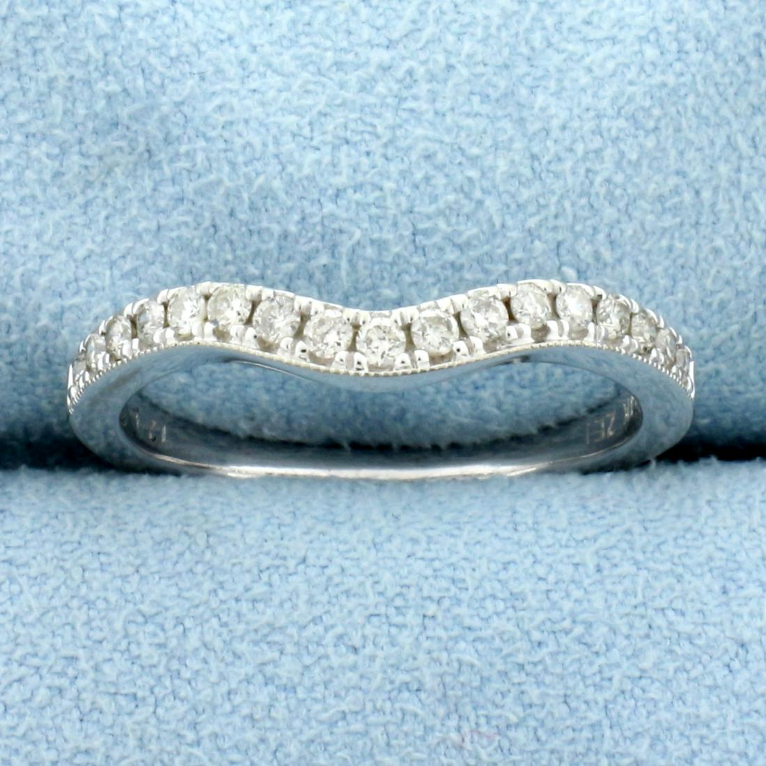 Curved Diamond Wedding Band Ring in 14K White Gold: In 14K White Gold. Contains seventeen high quality .01ct diamonds, SI clarity/G color. Curved design allows it to fit next to engagement ring. Size 7. 2.4g