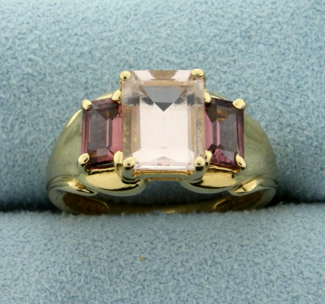 3.5ct TW Natural Morganite Ring in 14K Yellow Gold: In 14K Yellow Gold. Contains one natural 2.5ct emerald cut high quality Morganite gemstone with light salmoln pink color and excellent clarity. Also contains two high quality 1/2ct emerald cut Morgani