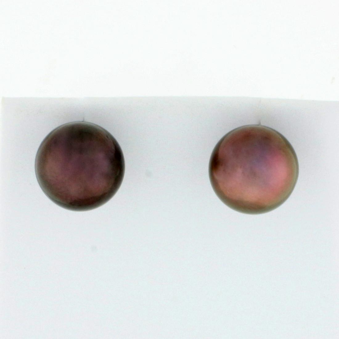 10mm Tahitian Pearl Stud Earrings in 14K Yellow Gold: In 14K Yellow Gold. Each earring contains one high quality 10mm Tahitian Pearl with a pink undertone and great luster. 3.5g.
