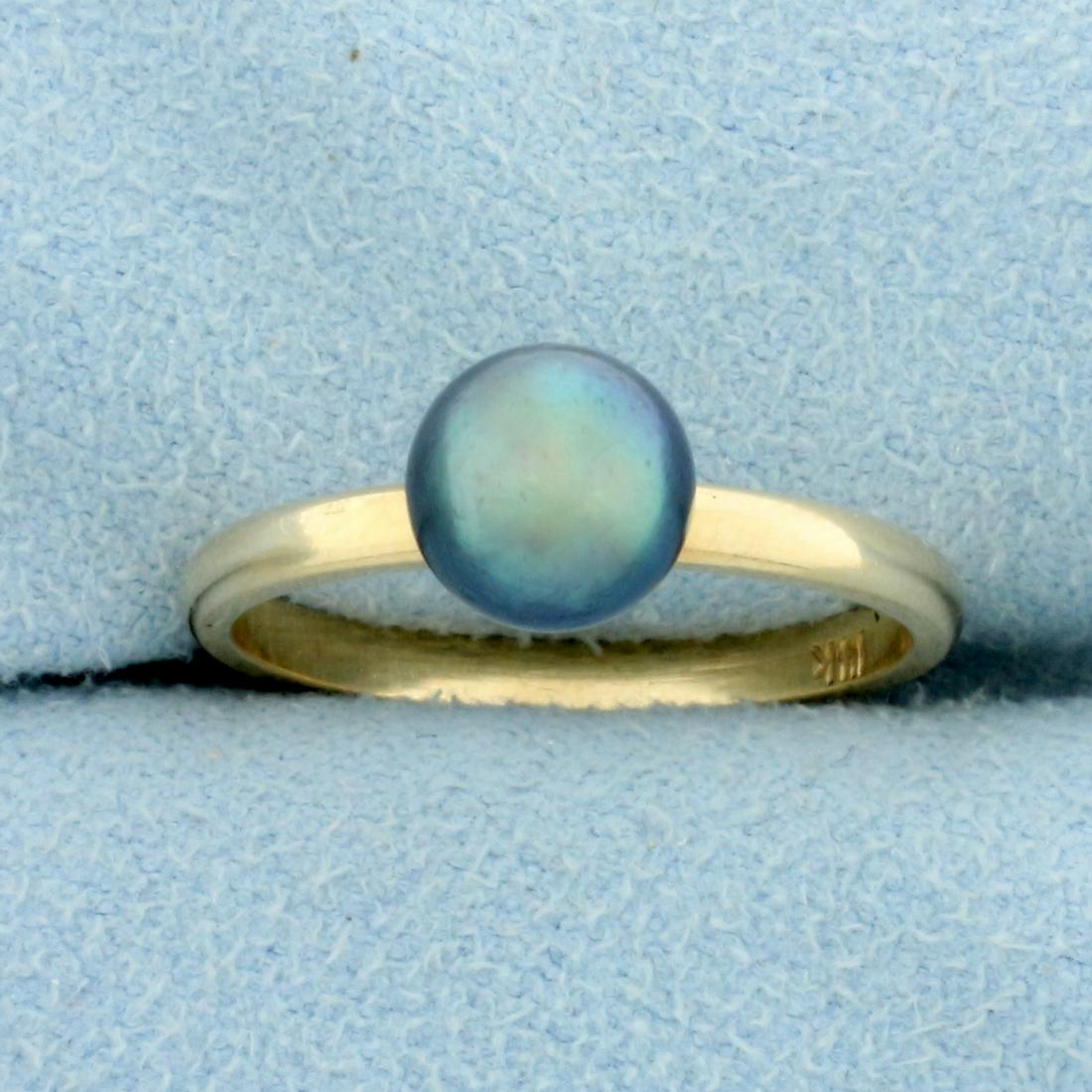 6.7MM Tahitian Pearl Solitaire Ring in 14K Yellow Gold: In 14K Yellow Gold. Contains one high quality natural 6.7mm Tahitian Pearl with beautiful peacock color and high luster. Size 6 1/4. 2.2g.