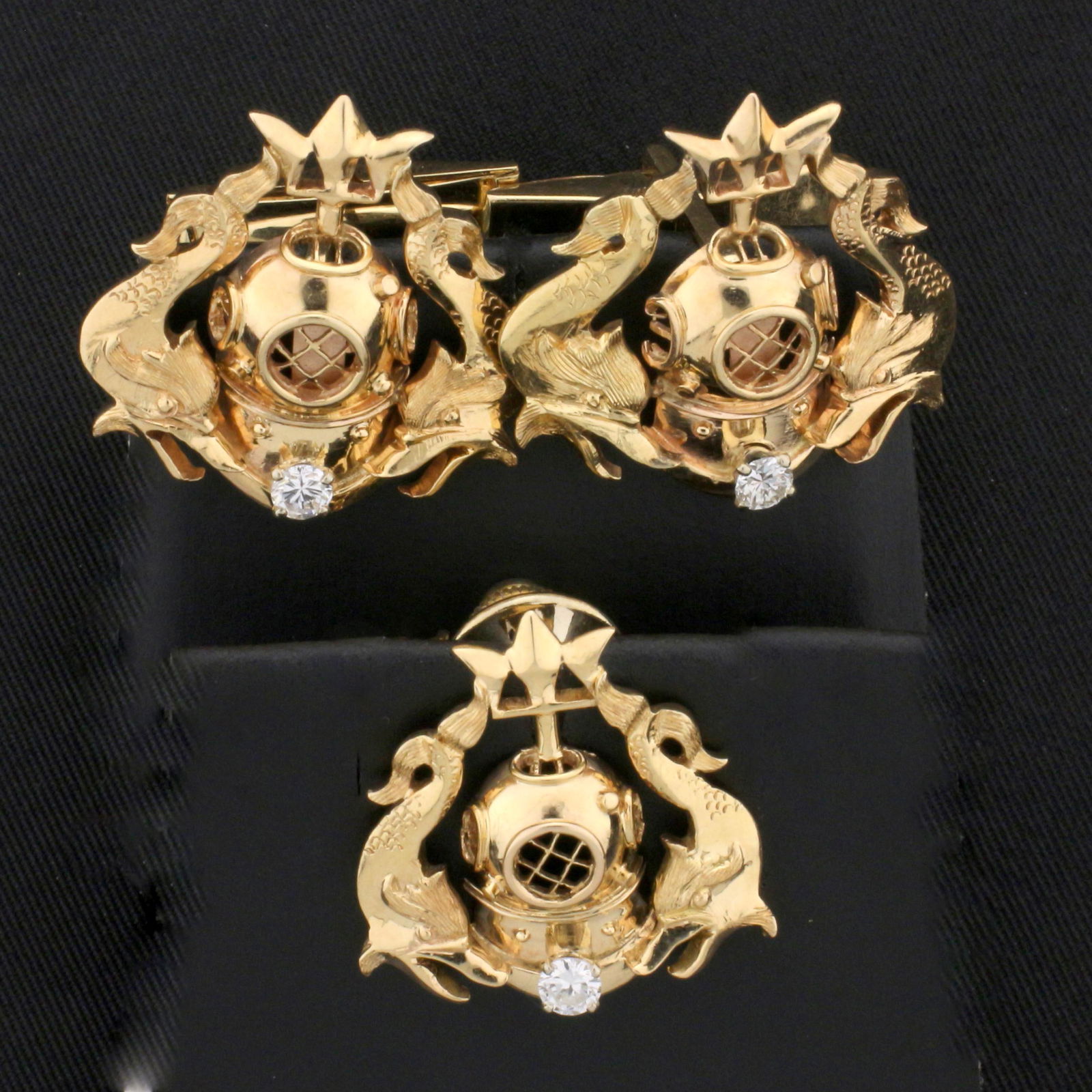 Diving Design Diamond Cuff Link and Tie Pin Set in 14K: In 14K Yellow Gold. Each cuff link and tie pin contains one high quality .1ct round brilliant cut Diamond, VS clarity/G color. Each piece is 7/8 inch long and 1 inch wide. 18.3g