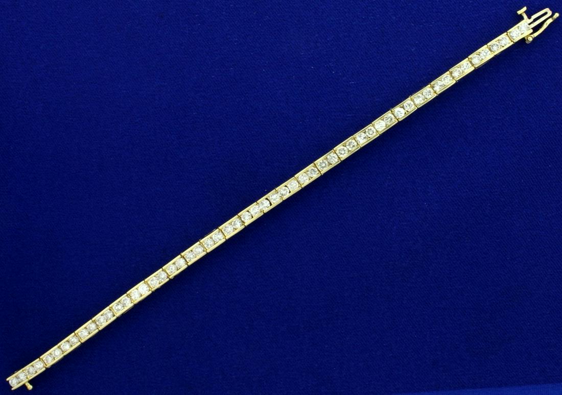 6ct TW Diamond Tennis Bracelet in 14k Yellow Gold: In 14k yellow gold. Contains fifty-six high quality diamonds, I1 clarity/H color. Diamonds have a great cut for lots of sparkle. 7 inches long, with safety clasp. 16.3g.