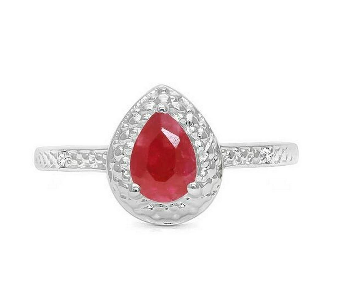 Ruby & Diamond Halo Ring in Sterling Silver: Pear cut .9ct ruby gemstone ring accented with .01ctw genuine diamonds. Size 7. Set in platinum over sterling silver, 2.1g.