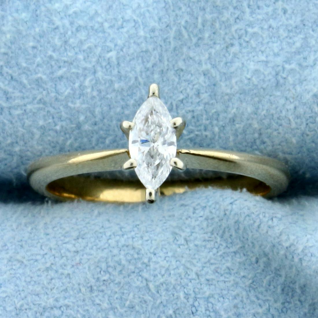 1/3ct Diamond Solitaire Engagement Ring in 14K Yellow: 14K Yellow Gold ring, head in 14k White Gold. Contains a high quality 1/3ct marquise Diamond, SI clarity/G color, great cut for lots of sparkle. Size 6 1/4. 2.3g