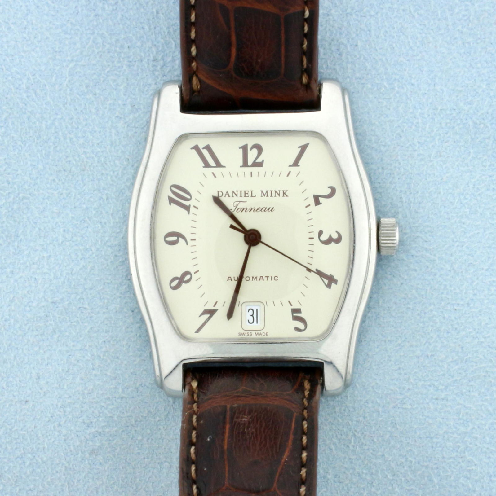 Daniel Mink Tonneau 3229 Automatic Watch: In Stainless Steel with Alligator Band. Swiss made automatic movement runs great. Watch in excellent condition with no scratching on crystal or case. Water resistant. Original band in worn condition.