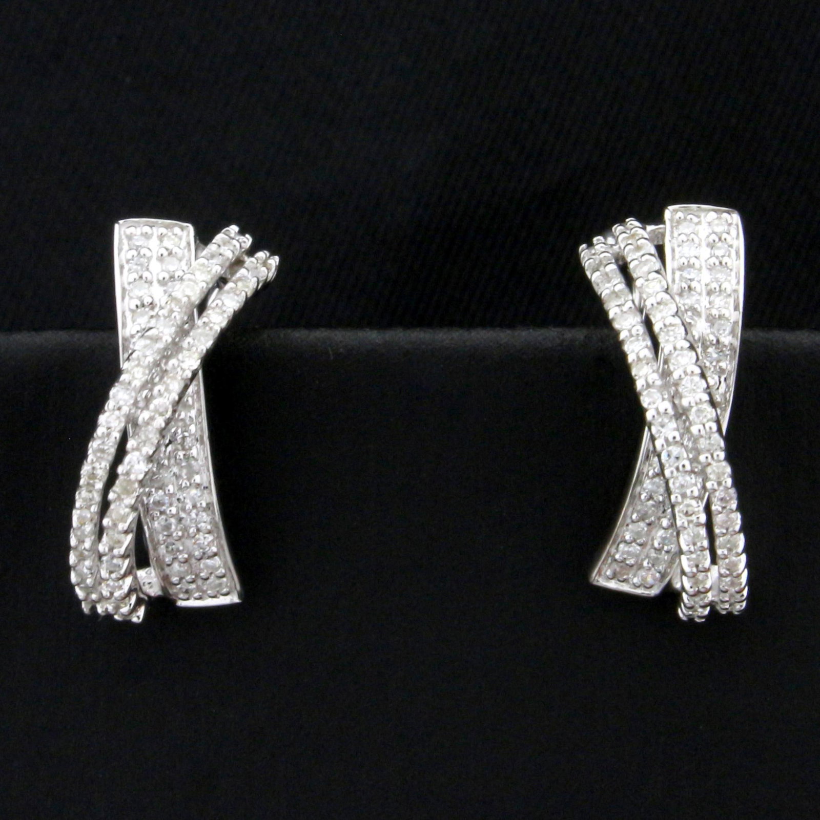 2/3ct TW Modern Design Diamond Earrings in 14K White: In 14K White Gold. Each earring contains 68 high quality 1/2pt Diamonds. 5/8 inch long, 5.5mm wide. Omega latch backs. 3.8g.