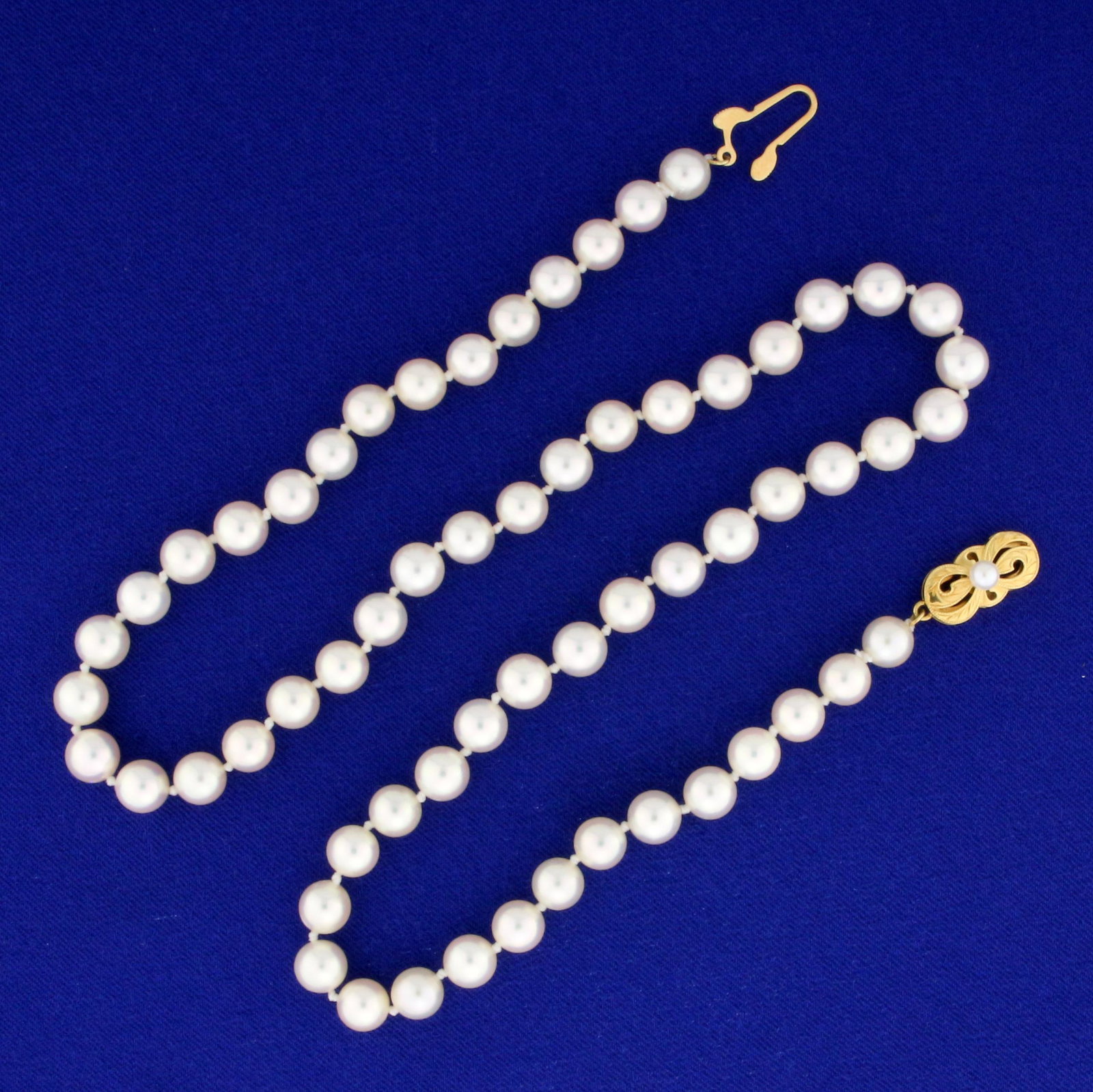 19 Inch Mikimoto Pearl Necklace with 18K Yellow Gold: 18K Yellow Gold Clasp. 19 inches long. Contains sixty one high quality natural 6.8mm Mikimoto Akoya Pearls with mirror-like luster. Newly restrung. 29.0g.