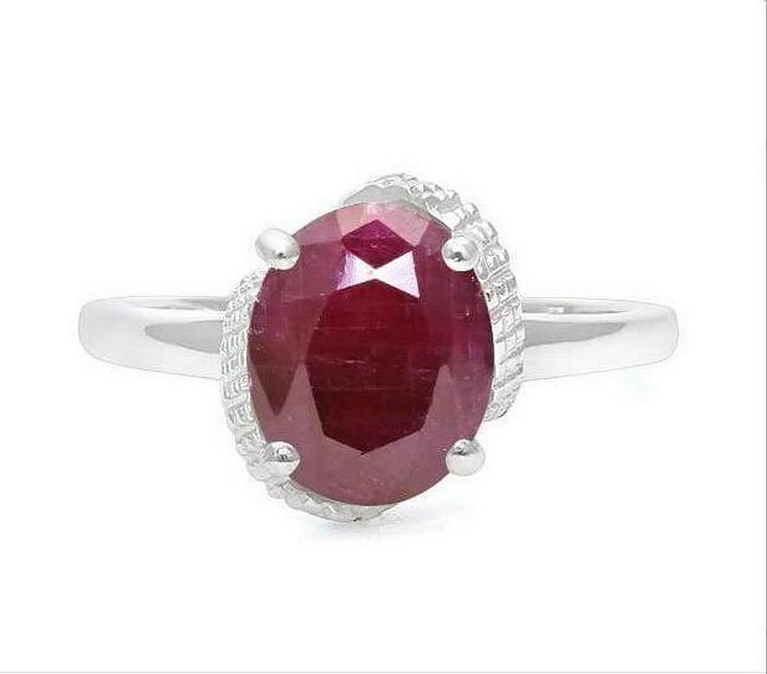 3.7CT Ruby & Diamond Ring in Sterling Silver: Oval cut 3.73ct genuine ruby gemstone with deep pomegranate red color accented with .01ctw genuine diamonds. Size 7. Set in platinum over sterling silver, 3.1g.