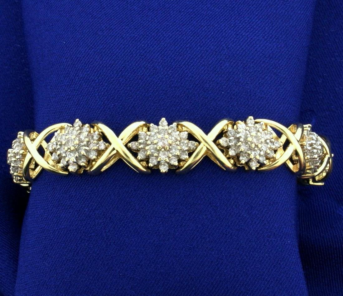 Over 7 ct TW Diamond Bracelet in 14k Gold: In 14k yellow gold. Contains ten .05ct diamonds, sixty .04ct diamonds, and one hundred and forty .03ct diamonds, I color/I clarity. 7" long with safety clasp and chain. 33.7g.