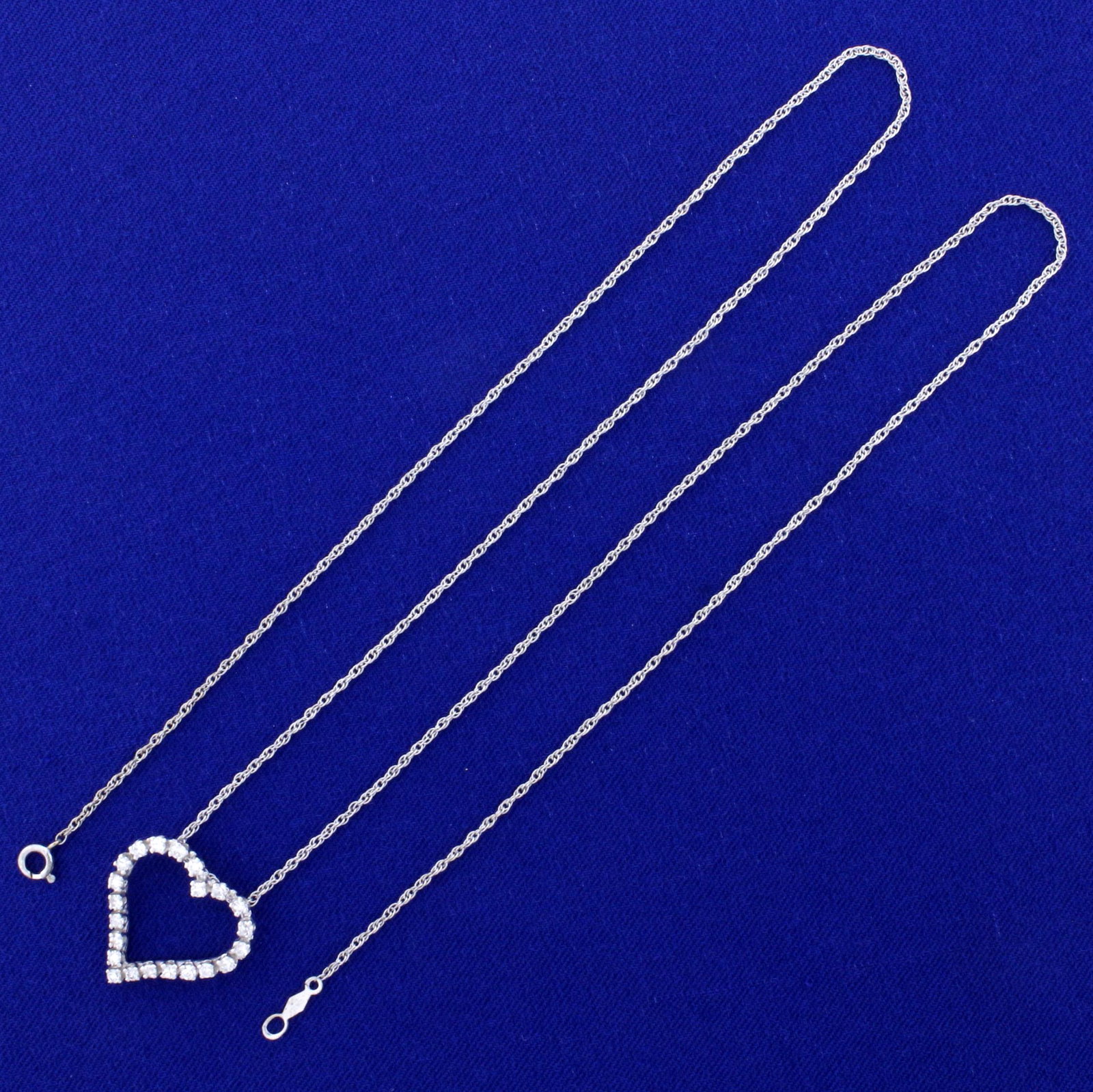 1/2ct TW Diamond Heart Necklace in 14K White Gold: In 14K White Gold. Contains twenty-two high quality Diamonds, SI clarity/G color. 22 inch long rope style chain with spring ring clasp. 3.8g