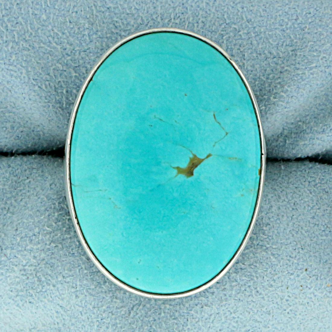 Renell Perry Designer Turquoise Statement Ring in: In Sterling Silver. Contains one high quality natural 44.5 x 21mm oval Turquoise gemstone with beautiful baby blue color. Size 8 1/4. 11.2g.