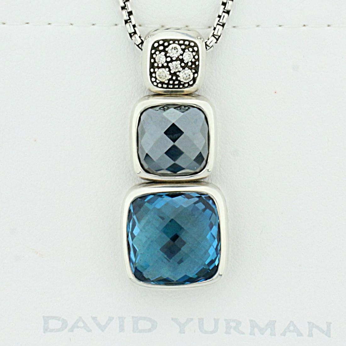 David Yurman Blue Topaz Onyx and Diamond Pendant with: In Sterling Silver. Contains one high quality natural 12.4mm checkerboard cut Blue Topaz gemstone with intense blue color and excellent clarity. Also contains one high quality natural 9.7mm checkerboa