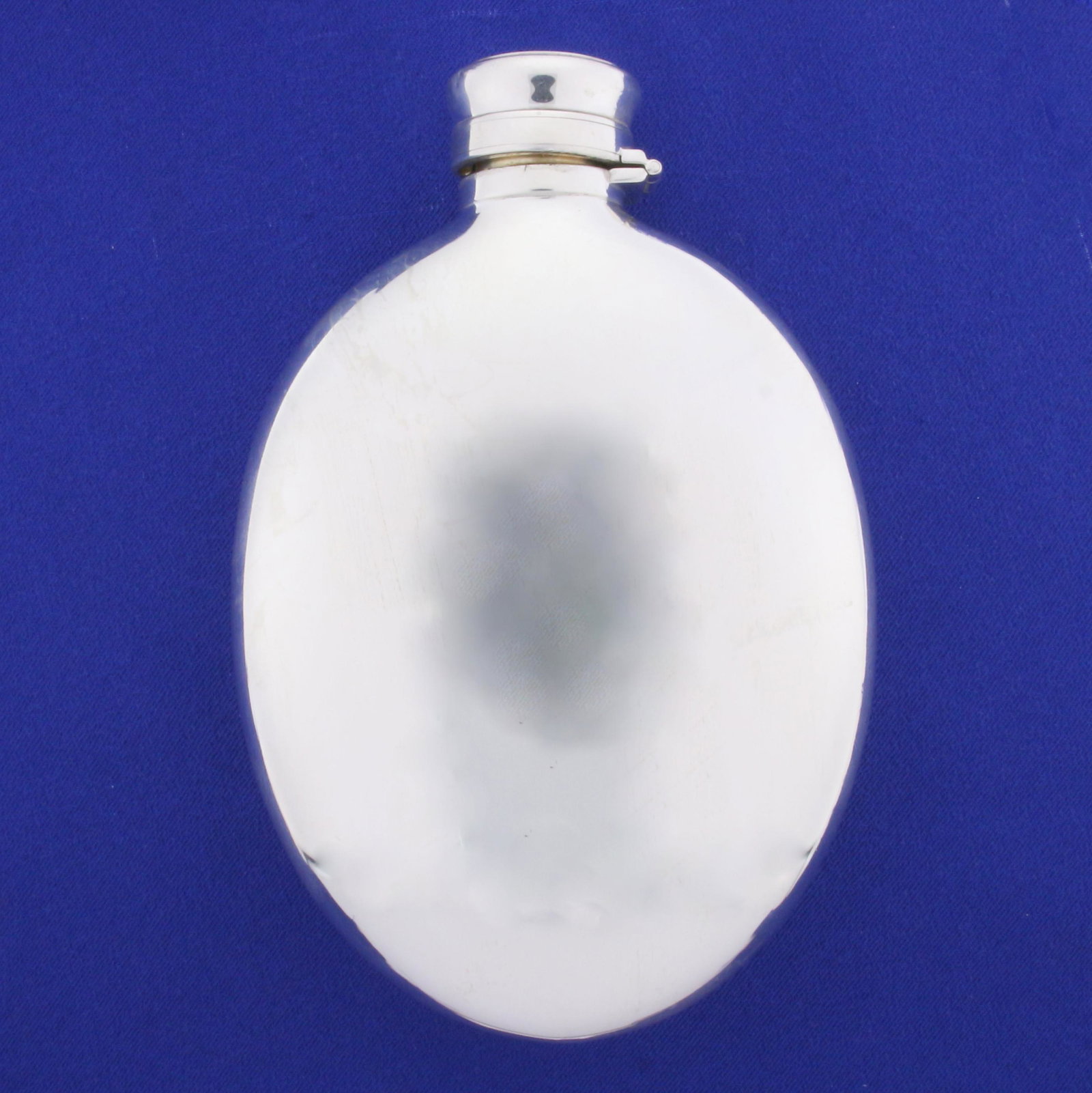 Vintage Sterling Silver Flask: In Sterling Silver. 5 1/4 inches long, 3 1/2 inches wide. Holds 3/8 of a pint. 156.7g.