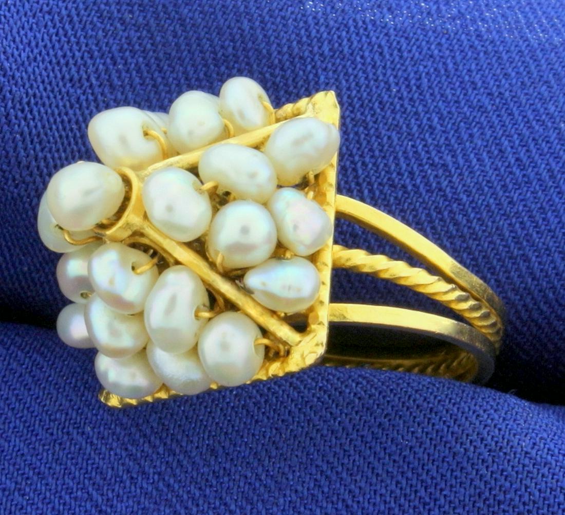 Vintage Pyramid Design Pearl Ring in 18k Yellow Gold: In 18k yellow gold. Contains twenty five 4mm baroque high quality pearls with unique silver tone and excellent luster. Unique pyramid design. Size 7 1/2. 7.3g.