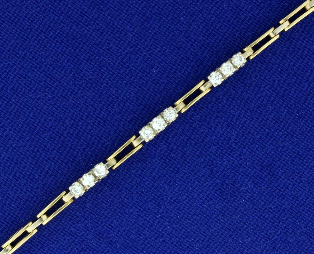 1 ct TW Diamond Designer Bracelet in 14k Gold: In 14k yellow and white gold. Contains nine high quality diamonds, VS clarity/H color. 7 1/2 Inches long, with safety clasp. 11.2g.