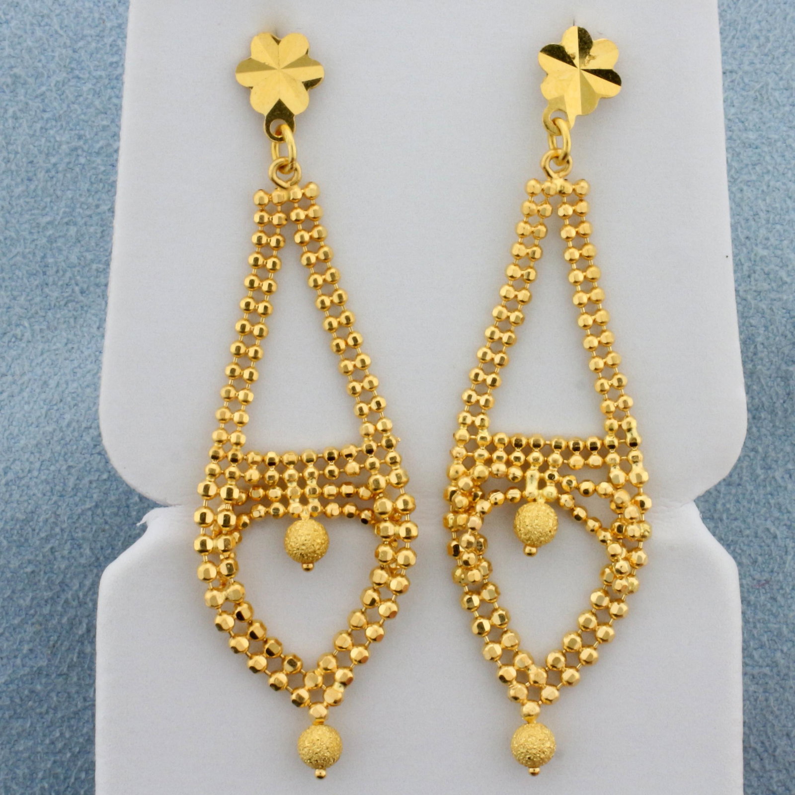 Dangle Earrings in 22K Yellow Gold: In 22K Yellow Gold. 2 inches long. Friction Backs. 5.7g.