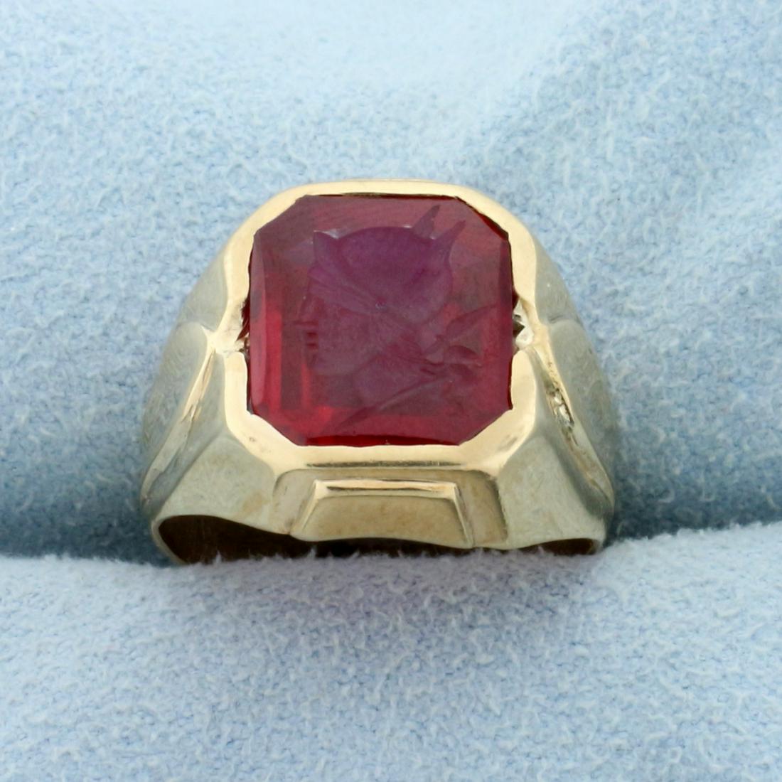 Lab Ruby Female Warrior Cameo Ring in 10K Yellow Gold: In 10K Yellow Gold. Contains one high quality natural 12x10mm emerald cut Lab Ruby gemstone with engraved Cameo of Female Warrior. Size 5. 5.3g