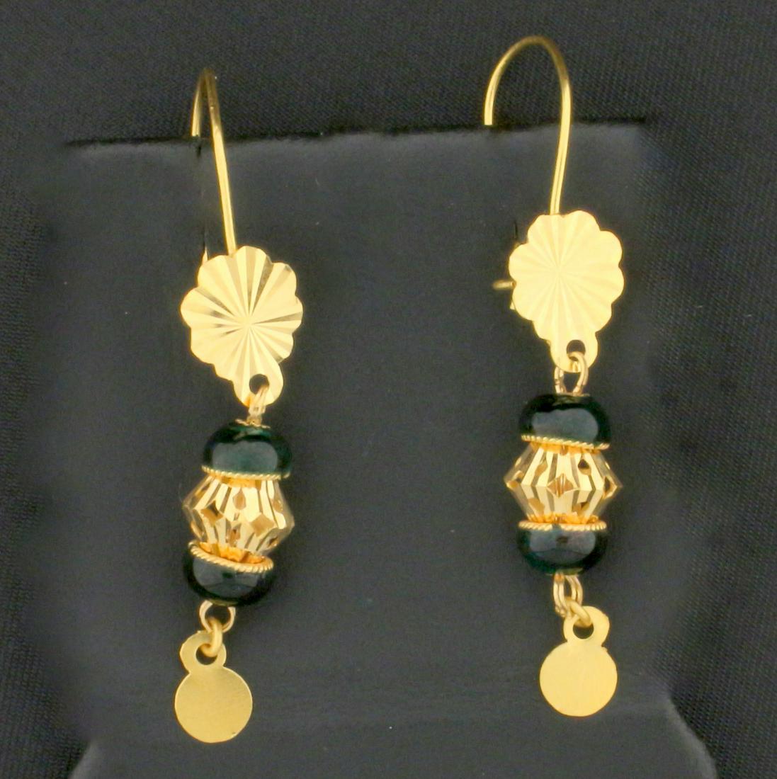Milan-Made Dangle Earrings in 21K Yellow Gold: In 21K Yellow Gold. 1 3/4 inches long, 7.6mm wide. Omega backs for pierced ears. 3.3g.