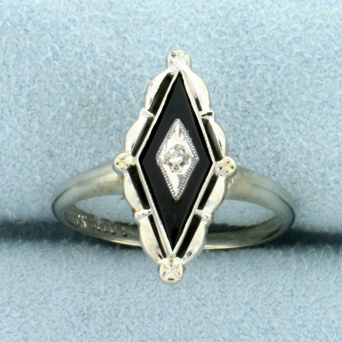 Vintage Onyx and Diamond Ring in 10K White Gold: In 10K White Gold. Contains one high quality natural 14x6 Onyx gemstone. Also contains one high quality 1/2pt Diamond. Size 8. 2.5g.