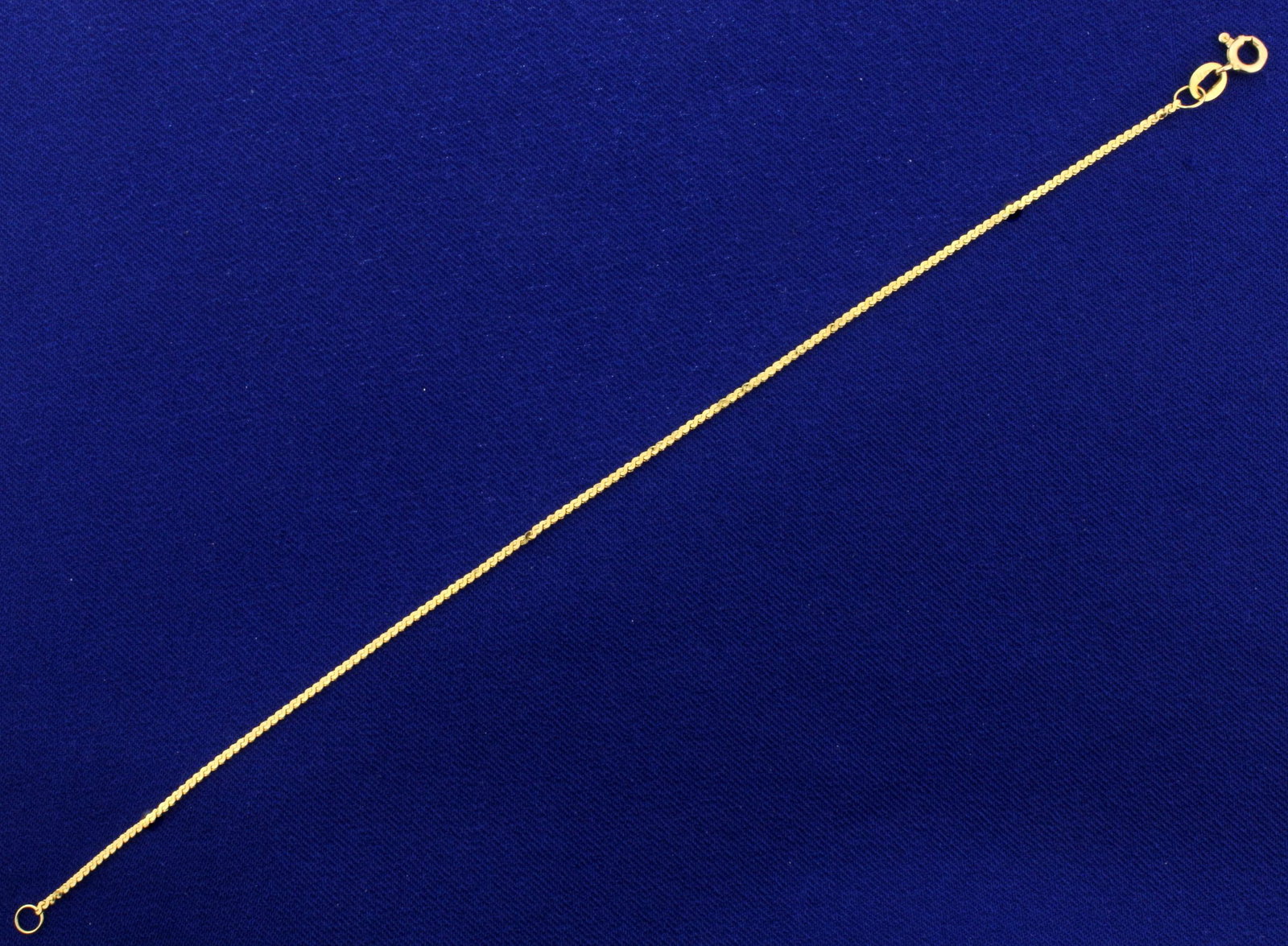 Italian Made S-Link Chain Bracelet in 14K Yellow Gold: In 14K Yellow Gold. 7 inches long with spring ring clasp. 1.15mm wide. 1.0g