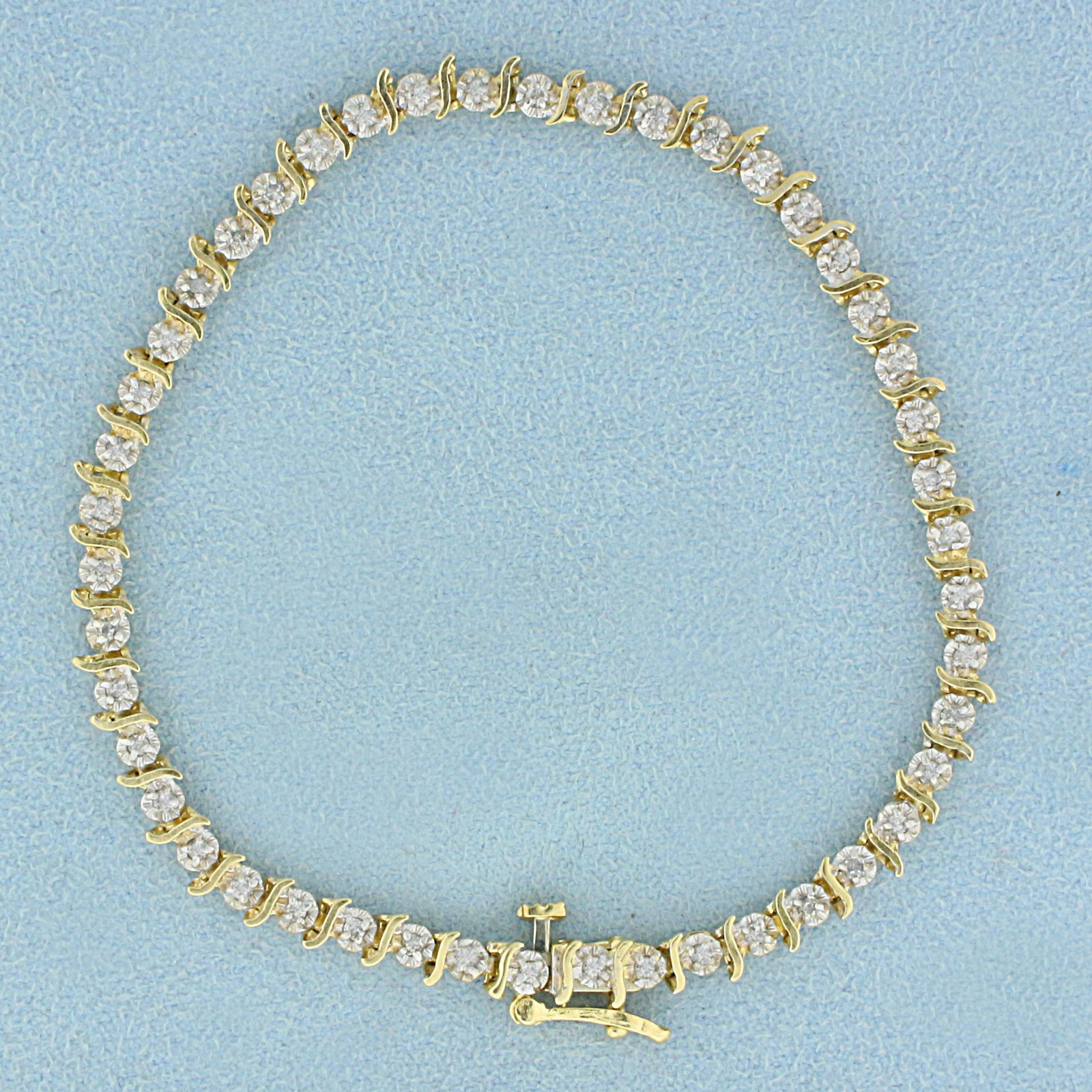 1/4ct TW Diamond Tennis Bracelet in 14K Yellow and: In 14K Yellow and White Gold. Contains forty six high quality 1/2pt Diamonds. 7 1/4 inches long. 3.8mm wide. Safety clasp. 5.1g