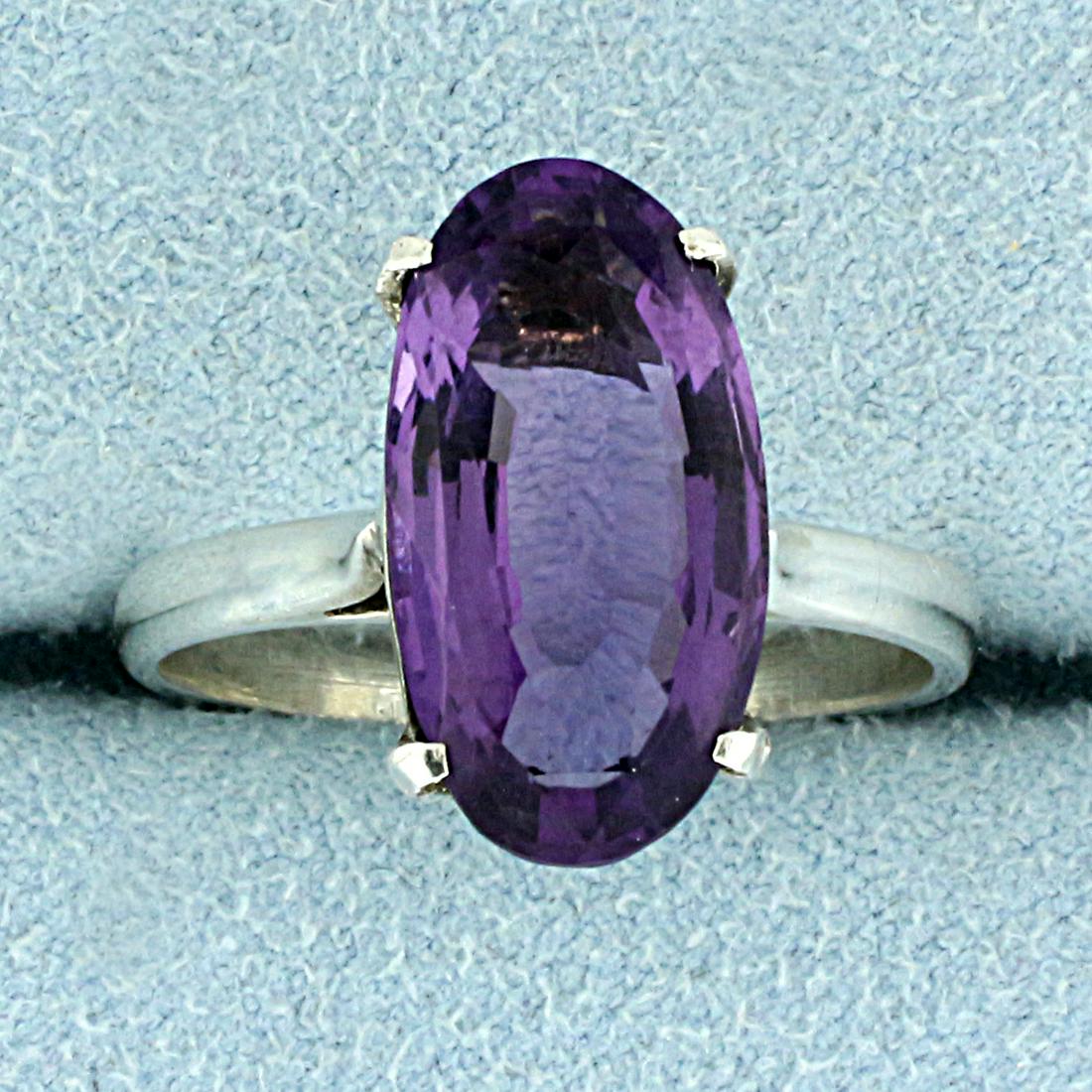 3.5CT Solitaire Amethyst Ring in Sterling Silver: In Sterling Silver. Contains one high quality natural 16x8mm Amethyst gemstone with intense purple color and excellent clarity. Size 7 1/2. 3.2g.