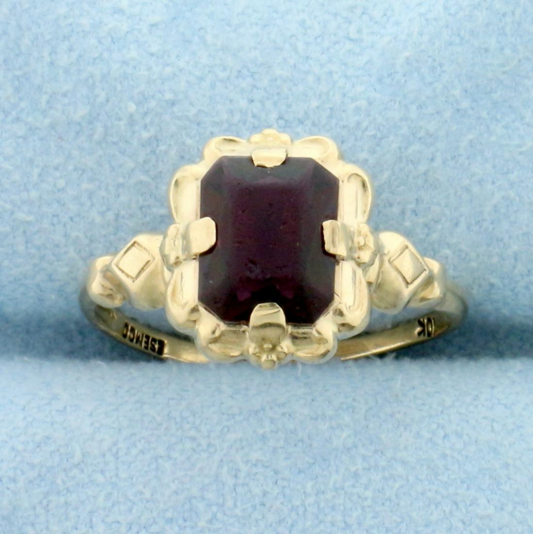 Antique Synthetic Ruby Ring in 10K Yellow Gold: In 10K Yellow Gold. Contains one7.5x6mm radiant cut Synthetic Ruby gemstones with deep red color and excellent clarity. Some abrasion on stone, indicative of age. Size 5. 1.3g