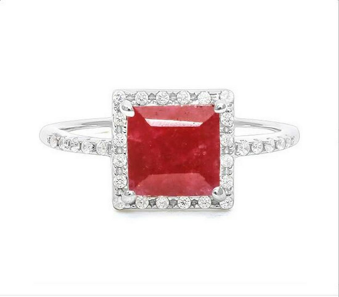 2.3CT Ruby Halo Ring in Sterling Silver: Princess cut 2.3ct genuine ruby gemstone ring with deep red color accented with white sapphires. Size 7. Set in platinum over sterling silver, 2.3g.
