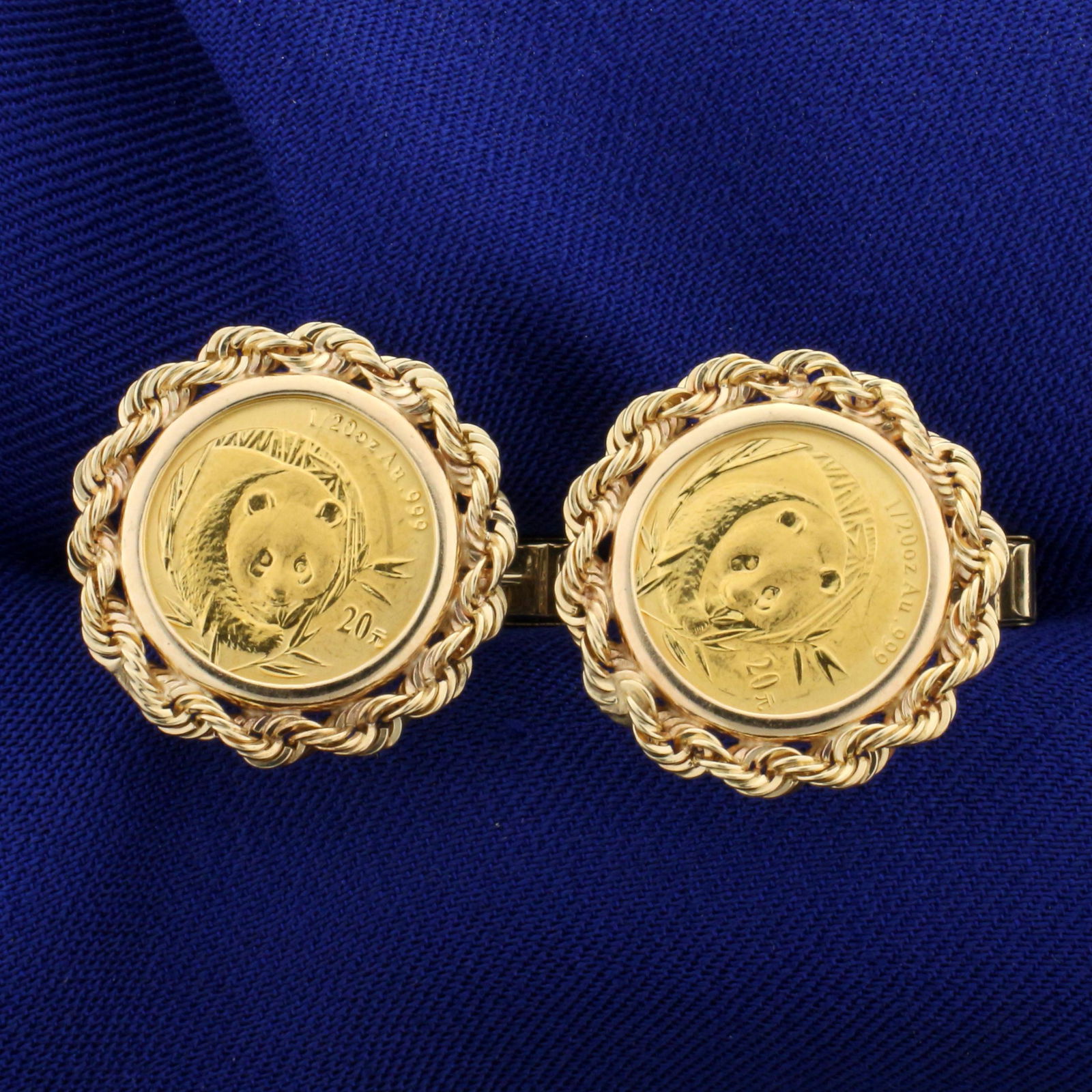 1/20oz 20 Yuan Chinese Panda Gold Coin Cuff Links in: In 14K Yellow Gold. Each earring contains a 1/20oz .999 pure gold 20 Yuan Chinese Panda Coin. 1 inch long, face is 3/4 inch diameter 12.0g