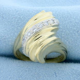 Designer Swirling Scroll Design Ring in 14K Yellow Gold: In 14K Yellow Gold. Contains eleven high quality .01ct round cut Diamonds, SI clarity/H color. Size 8 1/4. 9.7g.