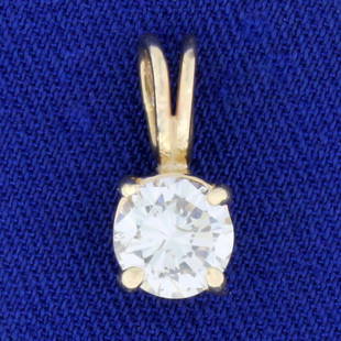 .9ct Solitaire Diamond Pendant in 14k Yellow Gold: In 14K Yellow Gold. Contains a high quality .9ct round brilliant cut Diamond, J color/SI2 clarity. 5/8 long. 1.0g.