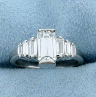 2.7ct TW Emerald Cut Diamond Engagement Ring in: In Platinum. Contains a center 1.5ct, two .25ct, two .2ct, and two .15ct high quality emerald cut Diamonds, F color /VVS clarity. Size 6 3/4. 7.2g