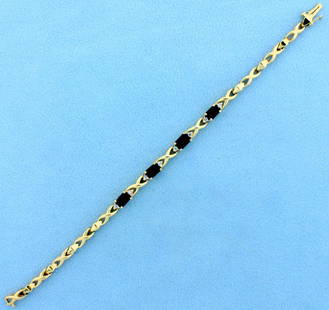 6 1/2 Inch Natural Sapphire and Diamond Gold Link: In 14K Yellow Gold. Contains four high quality natural 6x4mm emerald cut Sapphire gemstones with deep blue color and excellent clarity. Also contains eight high quality .01ct round cut Diamonds, SI